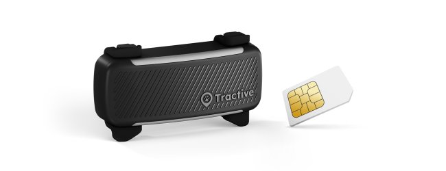 A black Tractive GPS and health tracker for dogs next to a SIM card on a white background